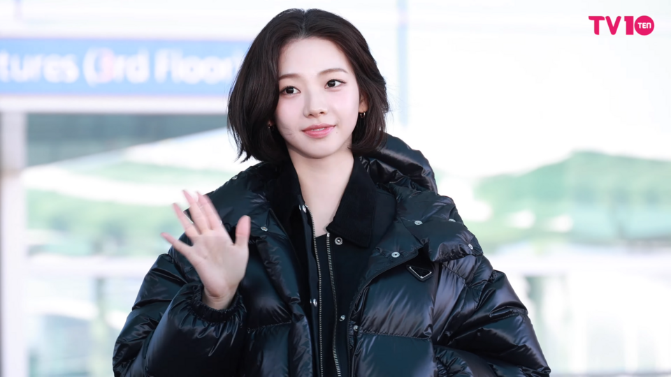 Aespa's Karina at an airport departure in 2025, styled in a fashion-forward outfit