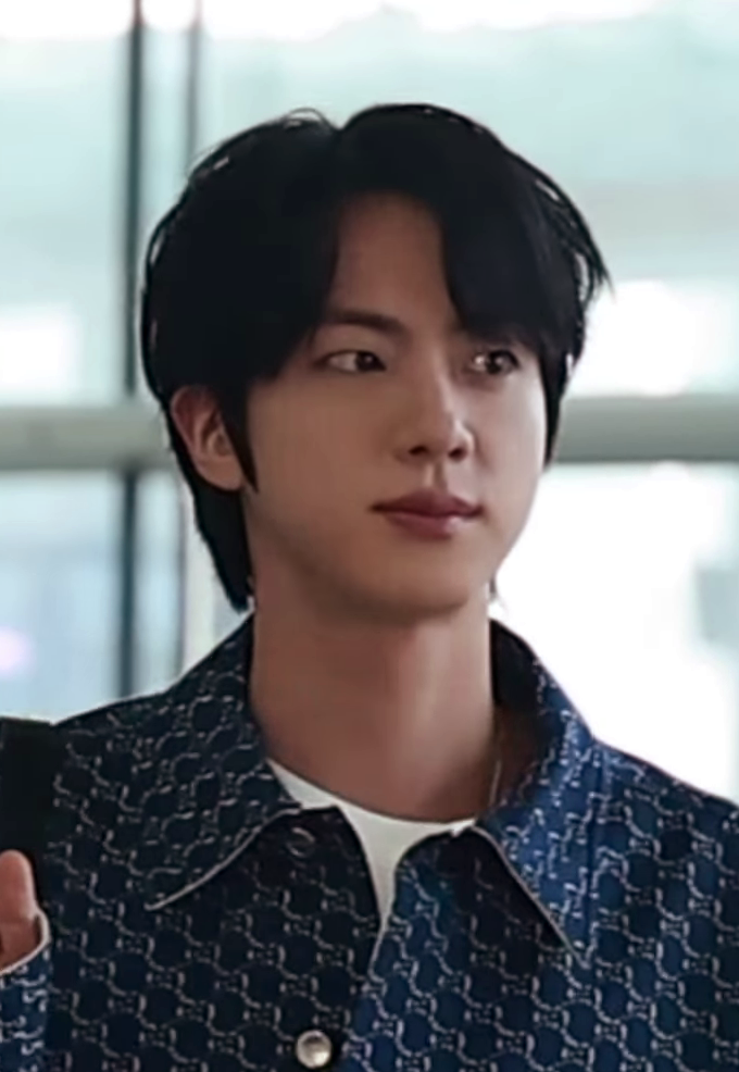 BTS's Jin at an airport departure in 2025, now a Gucci, Fred, and Laneige global ambassador